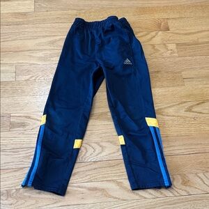 Retro Adidas Kids Navy Athletic Track Pants with Blue Stripes and Yellow Accents